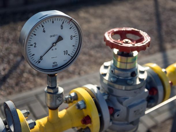 Gas infrastructure components, pressure gauge with red valve on yellow pipe