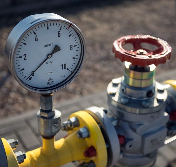 Gas infrastructure components, pressure gauge with red valve on yellow pipe