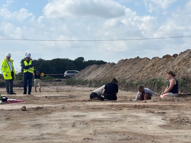 A group of archaeologists at the gas pipeline construction site uncovers an excavation, including two PSG employees