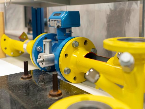 Yellow and blue pipes along with measuring devices that are part of the laboratory's equipment