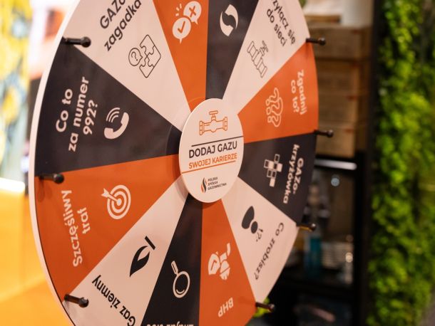 A wheel of fortune game board in PSG’s team colours, featuring various questions and tasks for participants