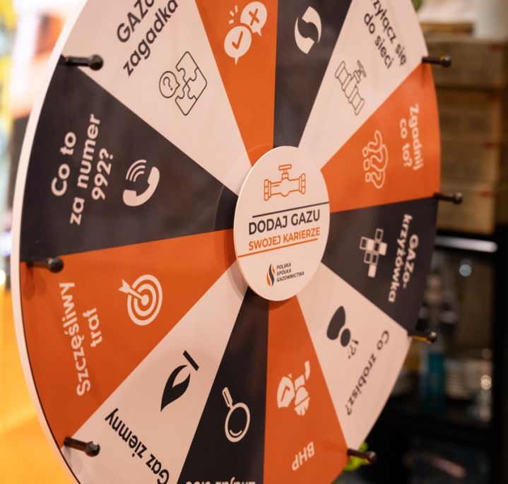 A wheel of fortune game board in PSG’s team colours, featuring various questions and tasks for participants
